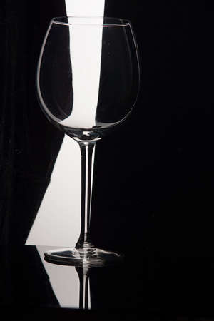 Empty wine glass on a black and white background.の写真素材