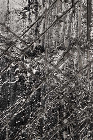 Concrete plated with silver and scratched diagonally, creative background, high resolutionの写真素材