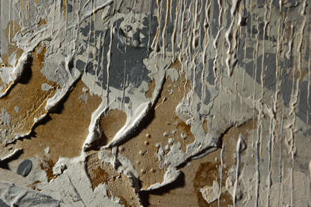 Dried pieces of paint on canvas, can be used as a background.の写真素材