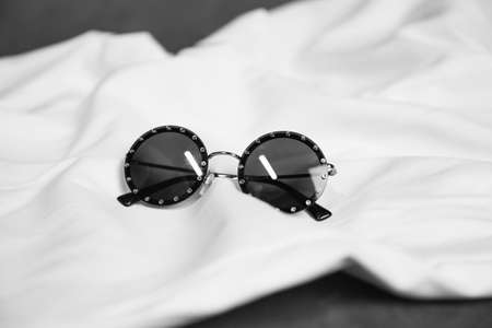 Sunglasses forgotten in bedの写真素材