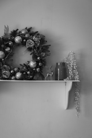 Christmas wreath with the rest of the decor on the wall shelfの写真素材