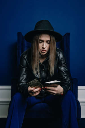 Fortune teller looks at tarot cardsの写真素材
