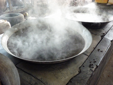 Preparation of sugar from coconuts the traditional way in Thailandの写真素材