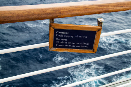 Warning sign on the slippery deck of the shipの写真素材