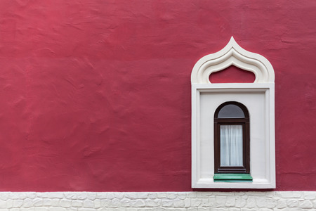 Background window on a red wall in the Russian styleの写真素材