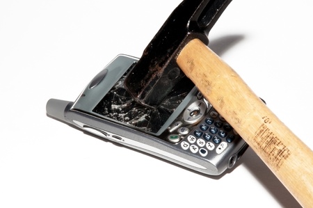 Cell phone - Hammer breaks a smartphoneの写真素材