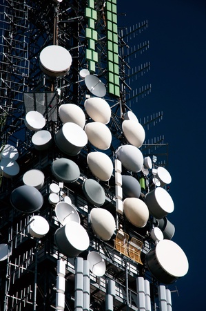 Big television and radio tower with several parabolic antenna on high quote (mountain) - Roncola (Italy)の写真素材