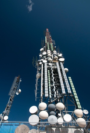 Big television and radio tower with several parabolic antenna on high quote (mountain) - Roncola (Italy)の写真素材