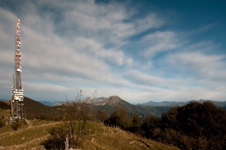 Big television and radio tower with several parabolic antenna on high quote (mountain) - Roncola (Italy)の写真素材
