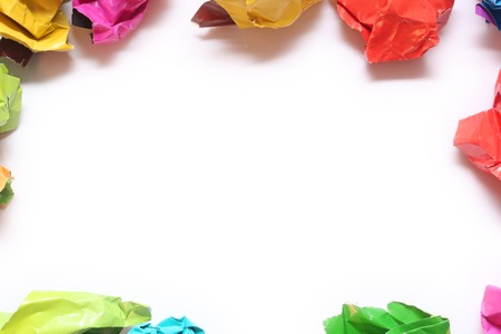 Crumpled color paper folded in a row. Crumpled paper isolated on white