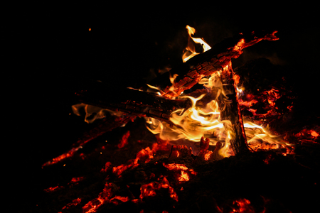 Smoldering coals on a black backgroundの写真素材