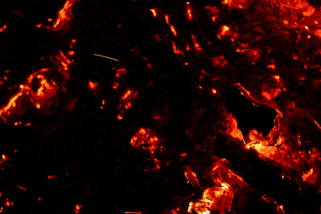 Smoldering coals on a black background