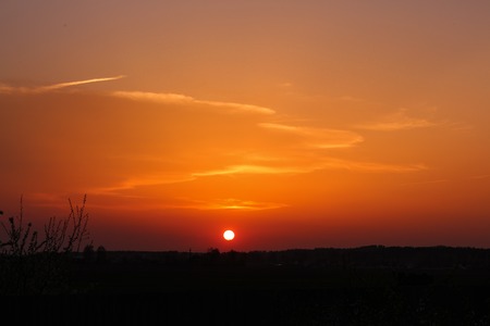 Orange sunset in the villageの写真素材