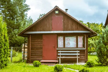 Old wooden house on a well-kept lawnの写真素材