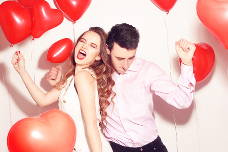 Sweetheart girlfriend Valentine Couple Party. Background red balloons hearts. Love concept. Crazy Empty copy space for your text.の写真素材