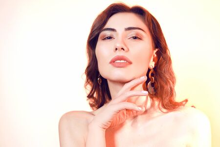 Gorgeous brunette with wrap hair portrait. Girl on a neutral background. Beauty portrait of a girl....