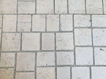 The texture of the stone floor, large stones, paving stones. Covering the road in the old town