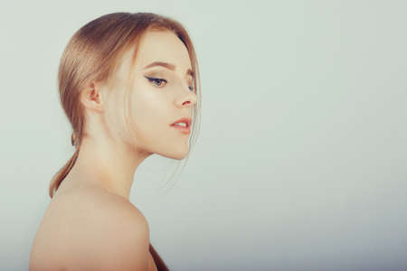 Beautiful portrait of a blonde with clean skin, baby face. Beautiful eyebrows and large lips.の写真素材