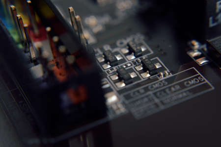 Close up. Young Man Repairing Motherboard from PC. Repair Shop. Worker with Tools. Computer...