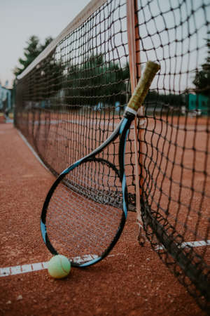 Tennis racket tennis ball and net. Large outdoor tennis field, sports, healthy lifestyleの写真素材