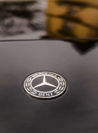 A beautiful photo of a black Mercedes on a city street. Luxurious expensive car. Transport. Marque...