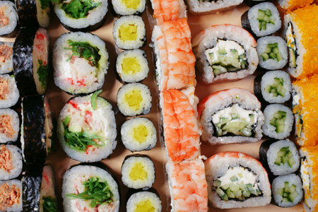 Maki and nigiri, sushi with fish, fresh salmon, shrimp and cheese, avocado rolls. Futomaki and Philadelphia with California. Set of sushiの写真素材