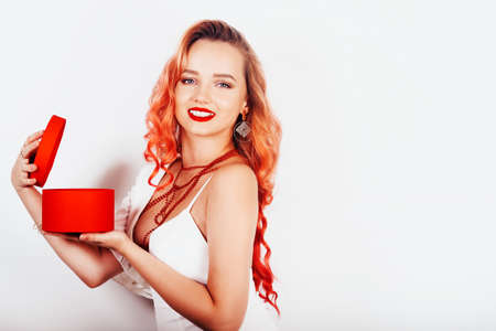New year christmas girl holding her gift in a red box.の写真素材