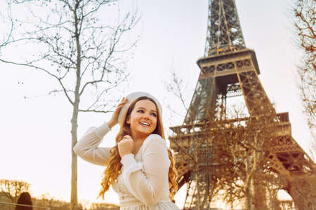 Traveler and tourist in Paris with the Eiffel Tower in the background. model pose.の写真素材