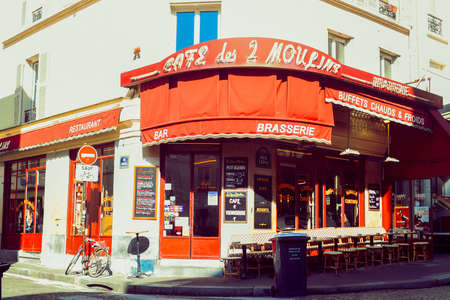 PARIS, FRANCE, March 8, 2022. famous cafe two mills on rue Lepic, Montmartre. Cafe two mills (Cafe des Deux Moulins) from the film about Amelie, one of the attractions of Paris.のeditorial素材