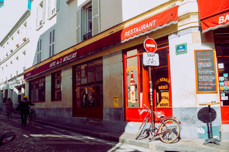 PARIS, FRANCE, March 8, 2022. famous cafe two mills on rue Lepic, Montmartre. Cafe two mills (Cafe des Deux Moulins) from the film about Amelie, one of the attractions of Parisのeditorial素材