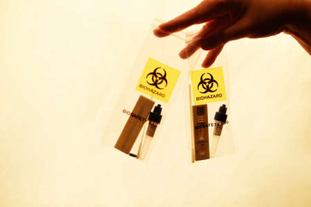 Positive test for in a plastic bag, home test for , pollution of the planet.の写真素材