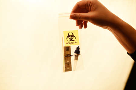 Positive test for a plastic bag, home test , pollution of the planet.の写真素材