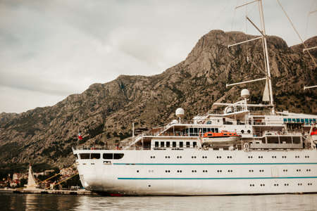 Montenegro. Tivat. 16/05/2022 Huge cruise ship with several floors in the port, several additional boatsのeditorial素材