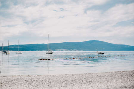 Yachts float on the background of mountains, beautiful views of tourist places.の写真素材