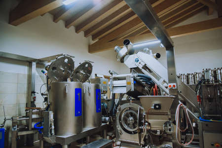 Olive oil plant. Olive farm with a factory. Machines for the production of olive oil and packagingの写真素材