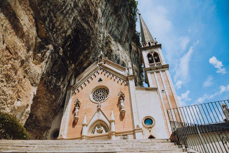 Italy, Spiazzi 07/09/2022 Santuario Basilica Madonna della Corona. Path to the church on top of the mountain monumentの写真素材