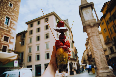 Fruit diet, fruits in a cup, strawberries, coconut and pineapples with kiwi. Italian snack. Healthy lifestyleの写真素材