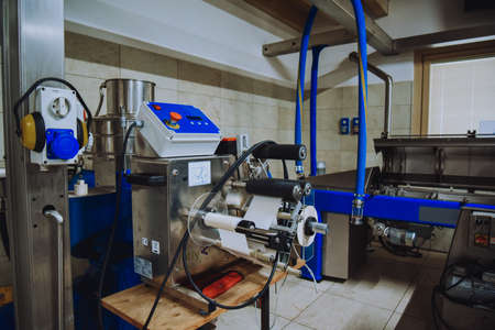 Olive oil plant. Olive farm with a factory. Machines for the production of olive oil and packagingの写真素材