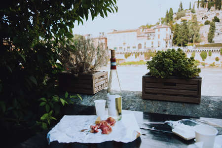 Wine and meat with cheese on a beautiful viewの写真素材
