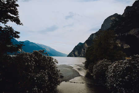 Riva del Garda. mountains beauty and vacation, summer day, travel. Water and lake beauty of nature, relaxion vibeの写真素材