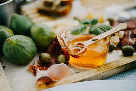Home cutting. Meat with olives, honey and figs. Food and nutrition, snacksの写真素材