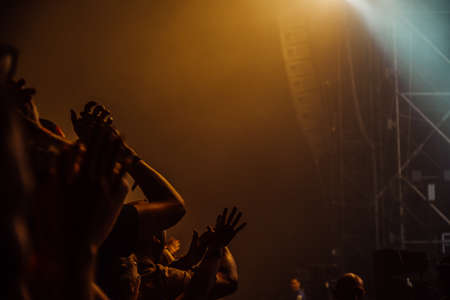 Night concert, people's hands, crowd near the stage, festivalの写真素材