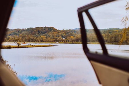 Traveling by car, view from the cabin to the lake and forest, nature and transportの写真素材