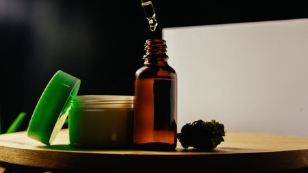 Glass bottle for marijuana oil, cosmetics with pipette. Cream and cosmetics with drugs, medicine and treatment. Beauty and health cbd and thc dropの写真素材