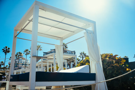 Beach lounge vacation and summer view of some beds in a beach club in a white sand beach in...
