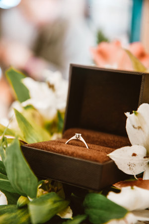 Wedding ring in a box close-up, gold ring with a diamond in flowers. Wedding, February 14,...