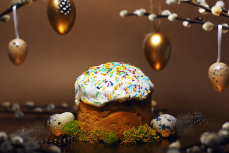 Homemade Easter cake, colored sprinkles in a shell. Quail eggs in hay, restaurant serving food. Easter and holidays on brown, Pussy willow, interesting decorations from golden eggs. restaurant servingの写真素材