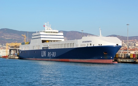 Trieste, ITA - 2 july 2011: Wiew of the port of Trieste to the sea with ship for transporting containers.のeditorial素材