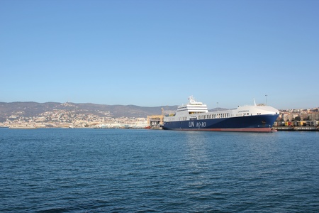 Trieste, ITA - 2 july 2011: Wiew of the port of Trieste to the sea with ship for transporting containers.のeditorial素材