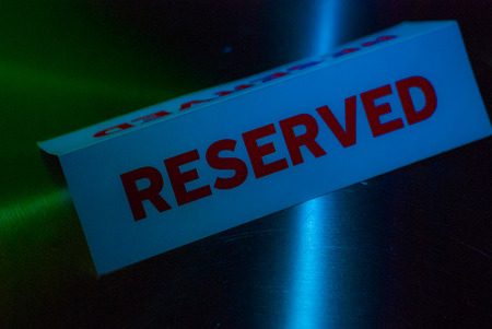 Reserve Signboard On Grunge Wood Table Night clubの写真素材